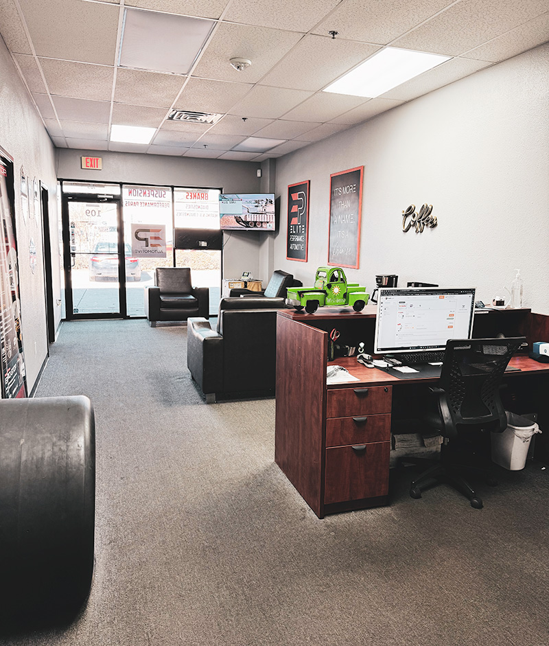 Elite Performance Automotive lobby interior with comfortable seating and refreshments